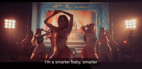 a group of women are dancing on a stage and one of them says i 'm a smarter baby smarter .