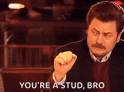 a man with a mustache is making a fist and saying `` you 're a stud , bro ''