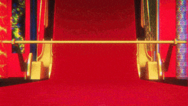 a room with a red carpet and a blue wall with a pattern on it