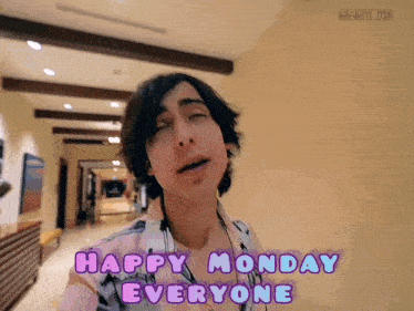 a man with his eyes closed and the words happy monday everyone below him