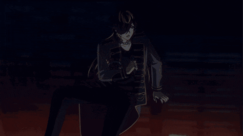 a man with long hair is standing in a dark room