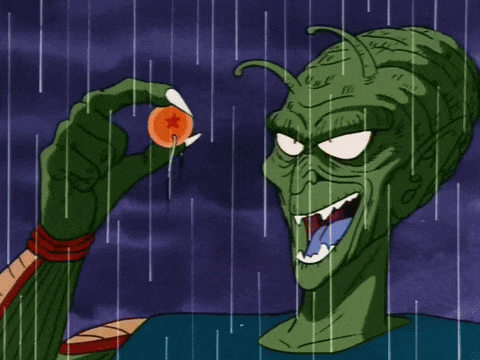 a cartoon of a green monster holding a dragon ball in his hand