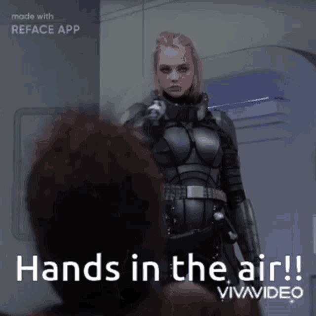 a woman in a black suit is standing next to a man with the words hands in the air on the bottom