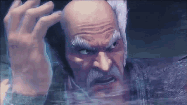 a bald man with a beard and mustache is looking at the camera