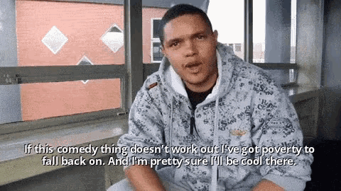 a man in a hoodie is talking about comedy