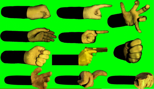 a bunch of hands on a green screen including one pointing a gun