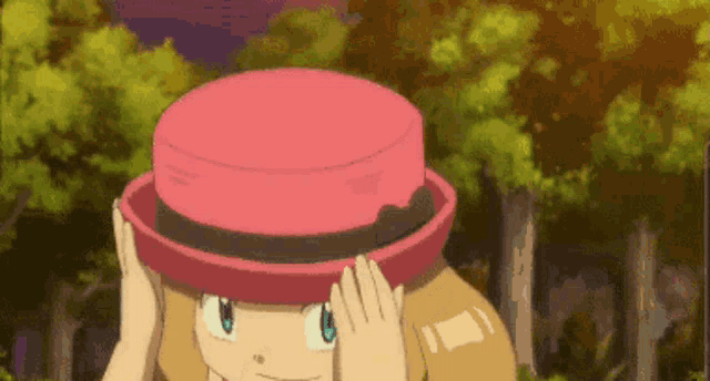 a cartoon girl is wearing a pink hat and covering her face .