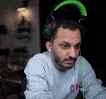 a man with a beard wearing headphones and a sweatshirt that says op on it