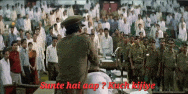 a man stands in front of a crowd with the words sunte hai aap kuch kijiye