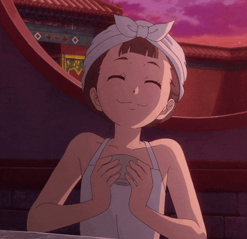 a girl with a towel around her head is holding a cup and smiling
