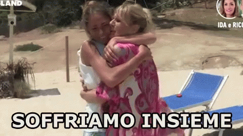 two women hugging each other on a beach with the words sofriamo insieme written below them