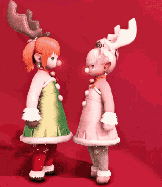 a girl with antlers on her head is standing next to another girl