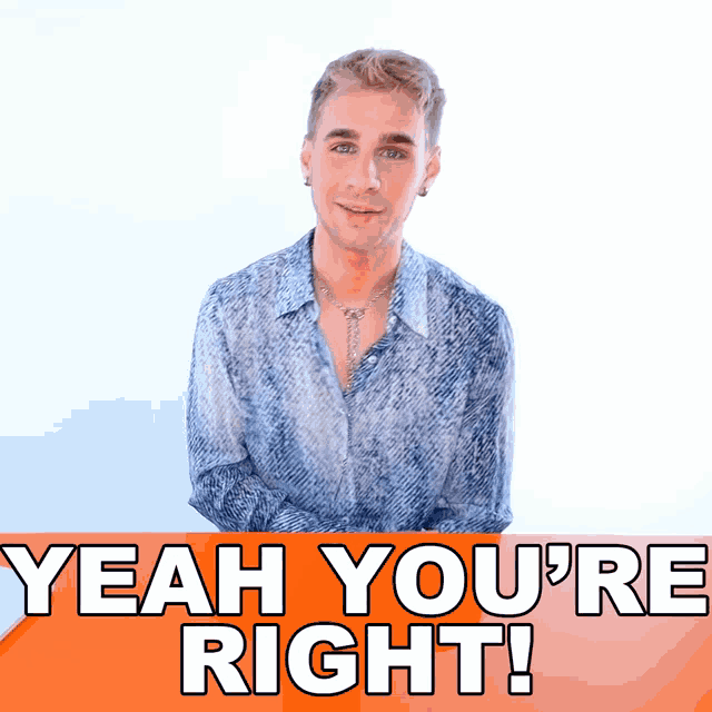 a man in a blue shirt is standing in front of an orange sign that says yeah you 're right