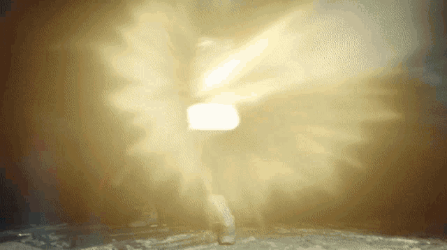 a blurred image of a person standing in a dark room