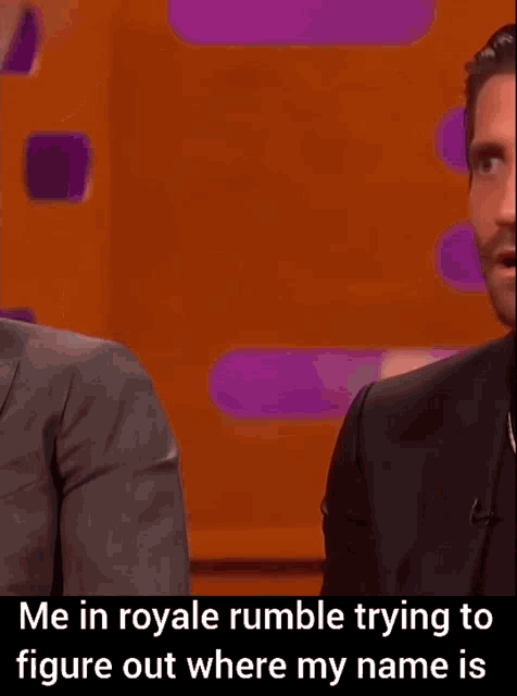 a man with a beard is trying to figure out where his name is .