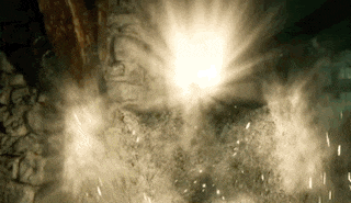 there is a light coming out of the ground and a lot of dust coming out of it .