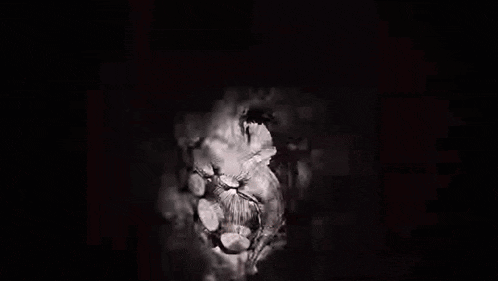 a black and white drawing of a monster with a woman in it .
