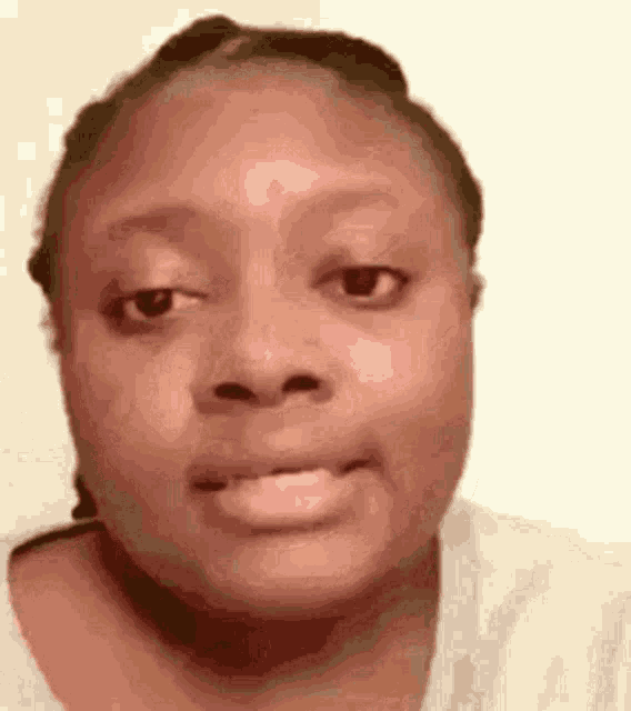 a close up of a woman 's face with a funny face .
