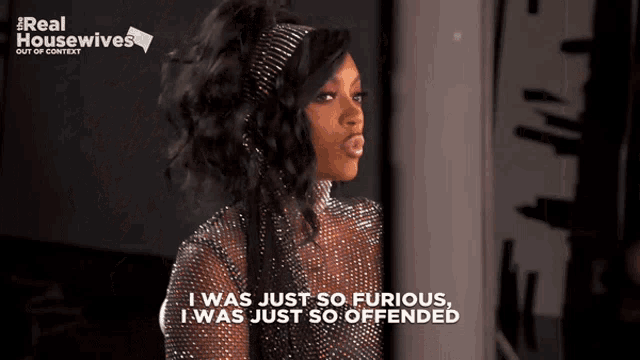 a woman says i was just so furious i was just so offended in front of a real housewives logo