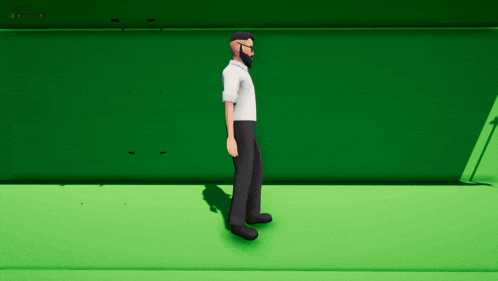 a man with a beard and glasses is standing on a green screen