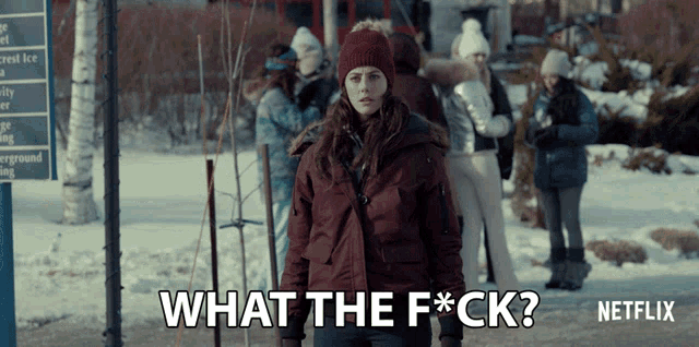 a woman standing in the snow with the words what the f * ck on the bottom