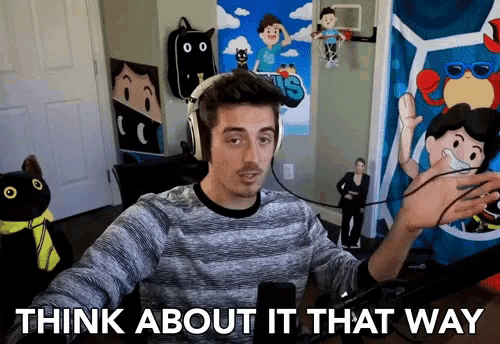 a man wearing headphones in front of a microphone with the words think about it that way below him