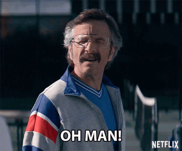 a man wearing glasses and a blue shirt says oh man