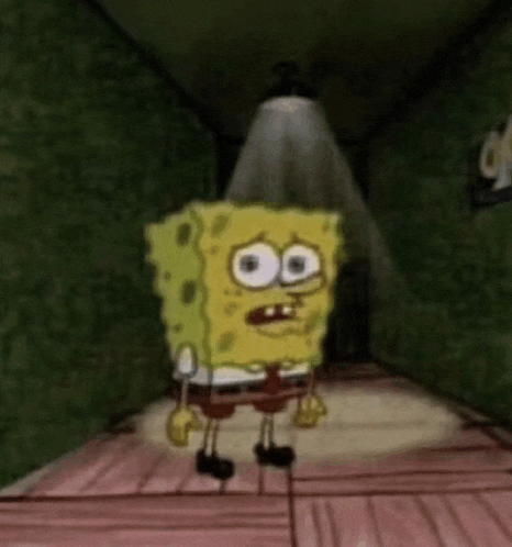 spongebob squarepants is standing in a dark hallway with a light shining on him .