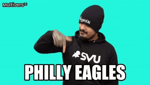 a man wearing a sweatshirt that says philly eagles on it