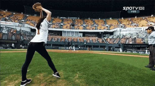 a woman is throwing a baseball in a stadium that says spotv hd vod