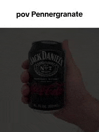 a person is holding a can of jack daniel 's and coca cola in their hand .