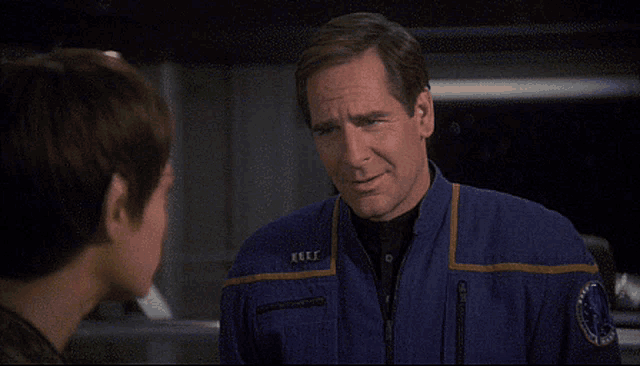 a man in a blue uniform with a patch that says united states of america