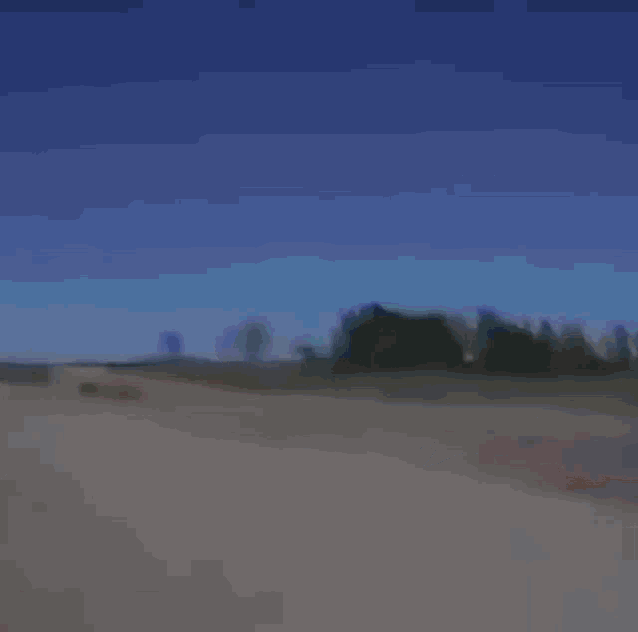 a man in a jacket is holding the steering wheel