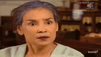 a woman with a surprised look on her face is on a tv show