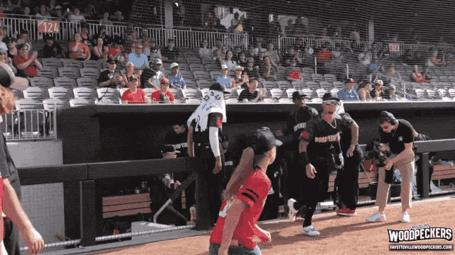 a baseball player wearing a jersey that says woodpeckers on the back