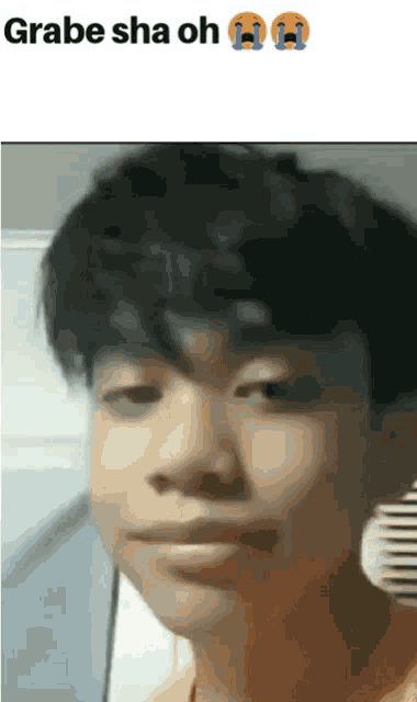 a close up of a person 's face with the words grabe sha oh