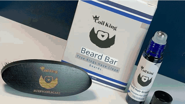 a bottle of coil king beard bar and a brush