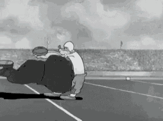 a black and white cartoon of two men playing a game of rugby on a field .