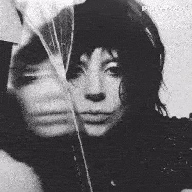a black and white photo of a woman with pixverse ai written on the bottom right