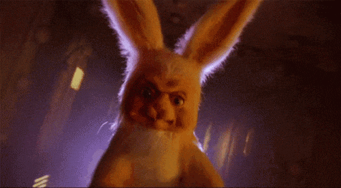 a close up of a stuffed bunny with a very angry face