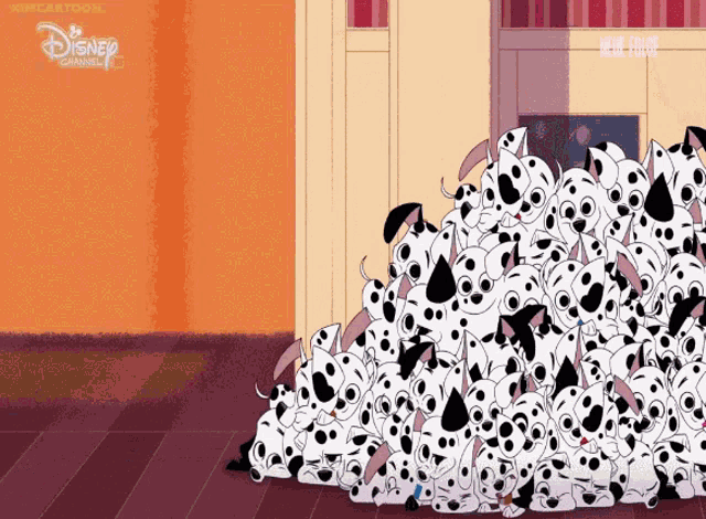 a bunch of dalmatian puppies are laying on the floor in front of a disney channel logo