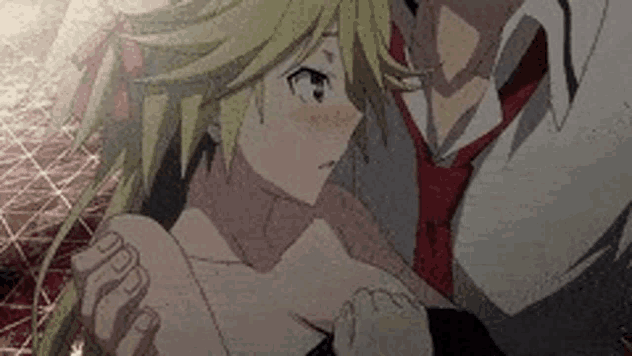 a man in a suit and tie is hugging a girl in a dress .