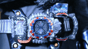 a close up of a watch with a red and blue circle on the face