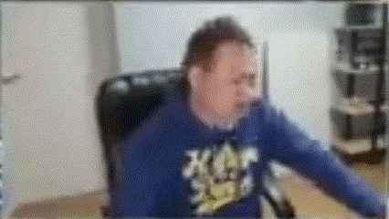 a blurry picture of a man wearing a blue shirt that says ' x-men ' on it