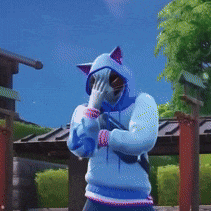 a person wearing a blue cat hoodie covering their face with their hand