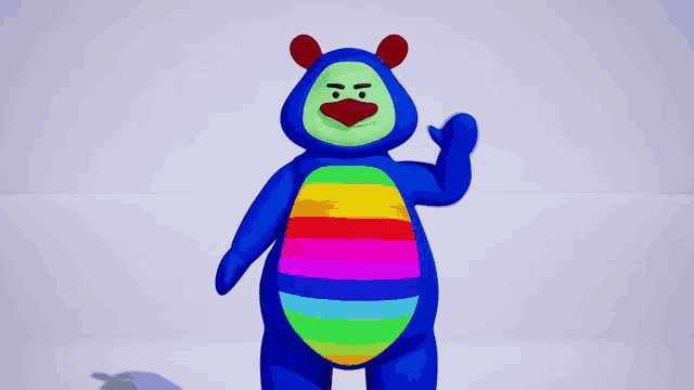 a blue stuffed animal with a rainbow colored belly