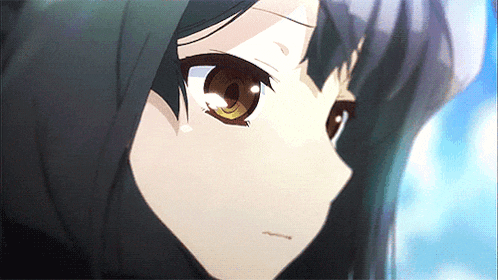 a close up of a girl with brown eyes