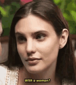 a woman is talking to a man and asking him if he is a woman .