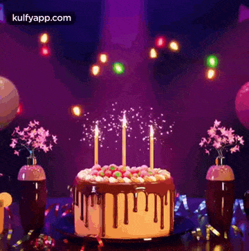 a birthday cake with candles on it is on a table with balloons and confetti .