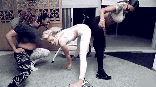 a group of women are doing stretching exercises